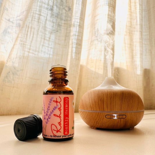 Rahat essential oil blend with clary sage, geranium, and lavender to promote emotional balance, relaxation, and hormonal harmony
