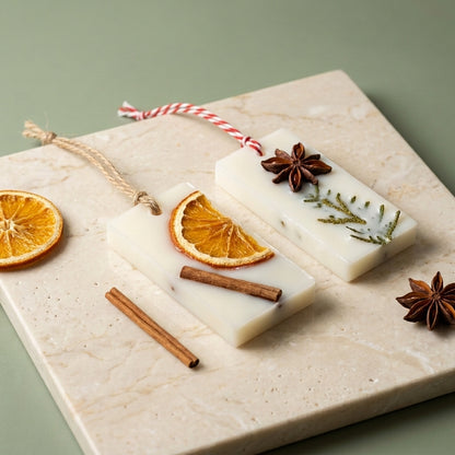 Mulled orange wax sachet with warm citrus and spice notes, crafted to gently fragrance closets and small spaces with a cozy aroma