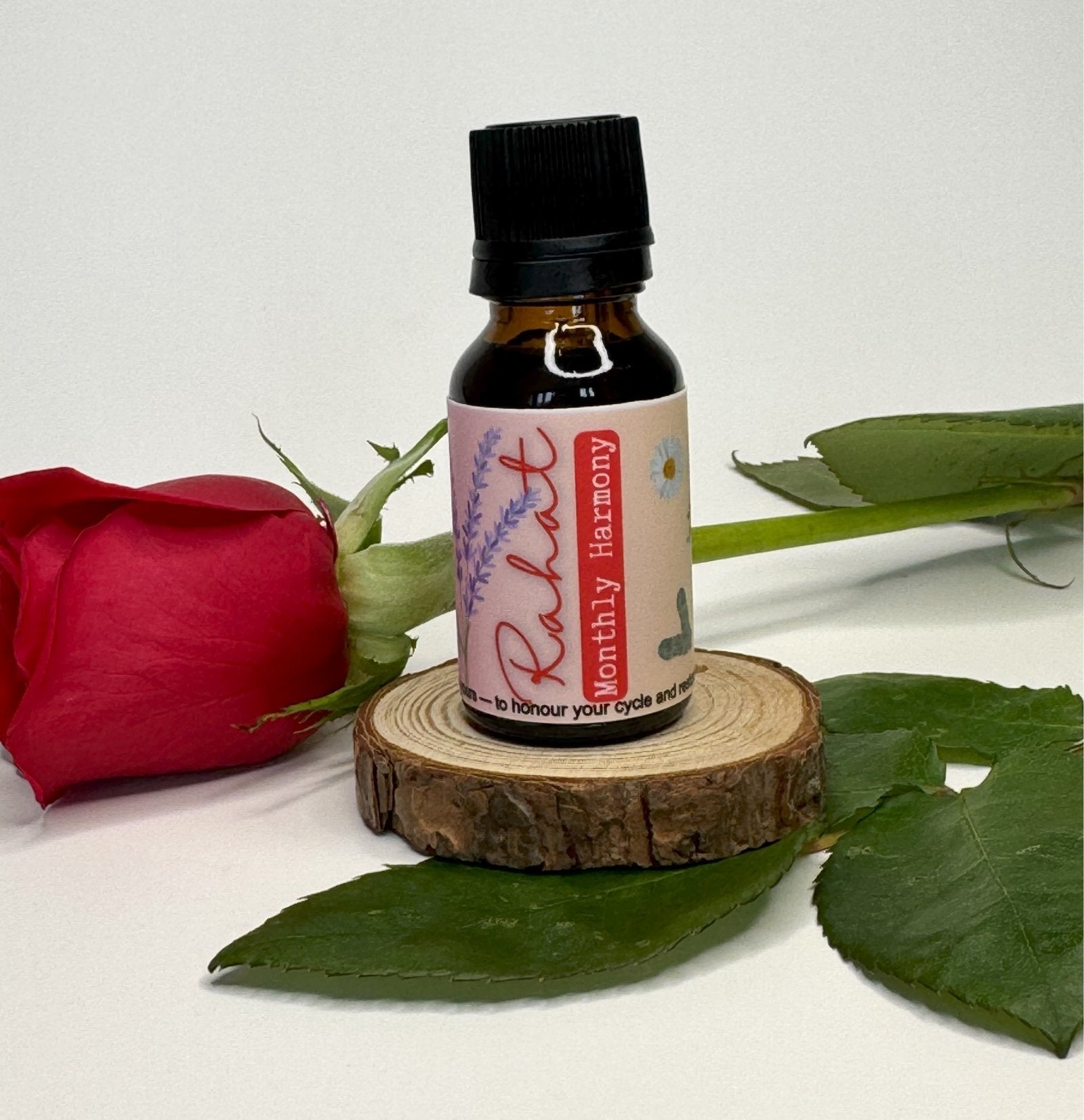 Rahat essential oil blend with clary sage, geranium, and lavender to promote emotional balance, relaxation, and hormonal harmony